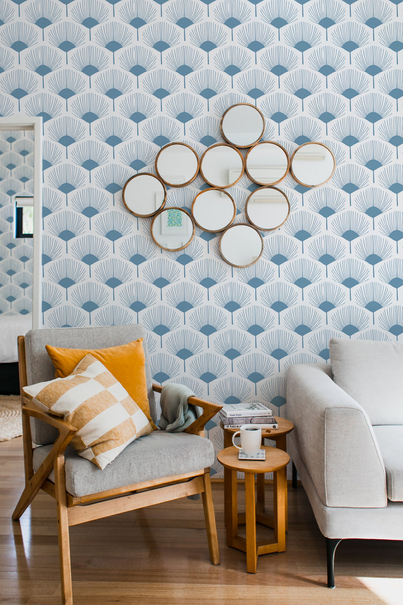 Abstract leaf veins pattern in a soft blue hue repeat across the wall, creating an organic and textured effect. Traditional wallpaper.