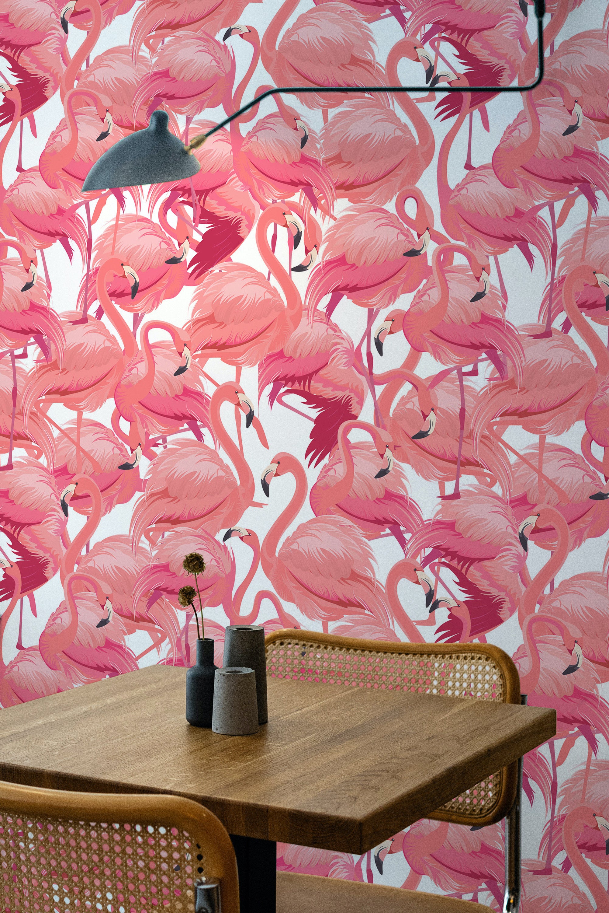 Self-adhesive wallpaper with a vibrant pink flamingo pattern, creating a tropical and lively atmosphere, complementing the minimalist decor of the room.