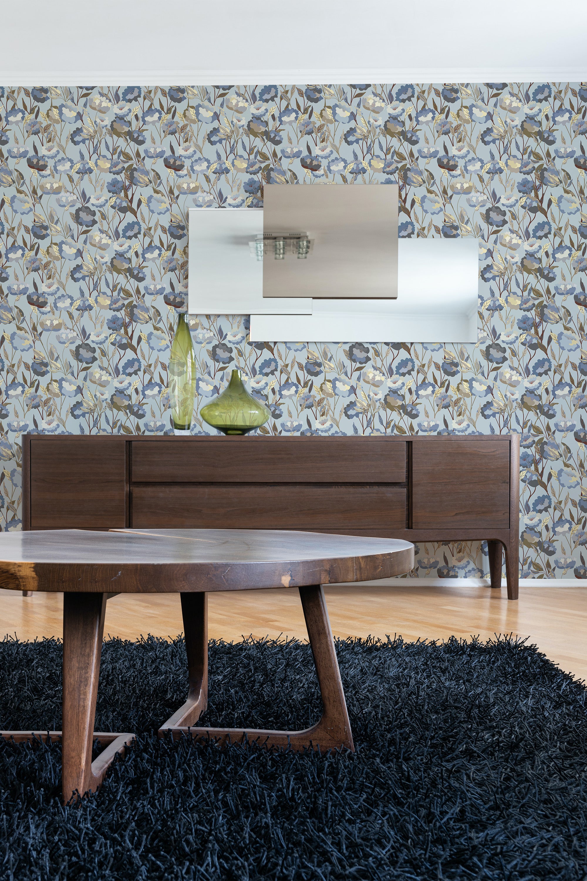 Room with wallpaper adorned with a classic floral pattern in muted blue and beige tones, creating a soft, elegant atmosphere. Traditional wallpaper.