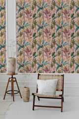 Wallpaper with a detailed Palm tree pattern, featuring lush green leaves and pink accents, installed in a room with minimalistic decor. Traditional wallpaper.