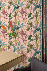 Self-adhesive wallpaper with a vibrant Palm tree design, featuring lush green and pink leaves against a soft peach background, creating a tropical and lively ambiance in the room.