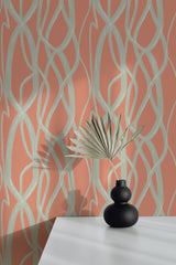 Self-adhesive wallpaper with an abstract line pattern in pale green on a warm coral background, adding a modern, stylish touch to the room.