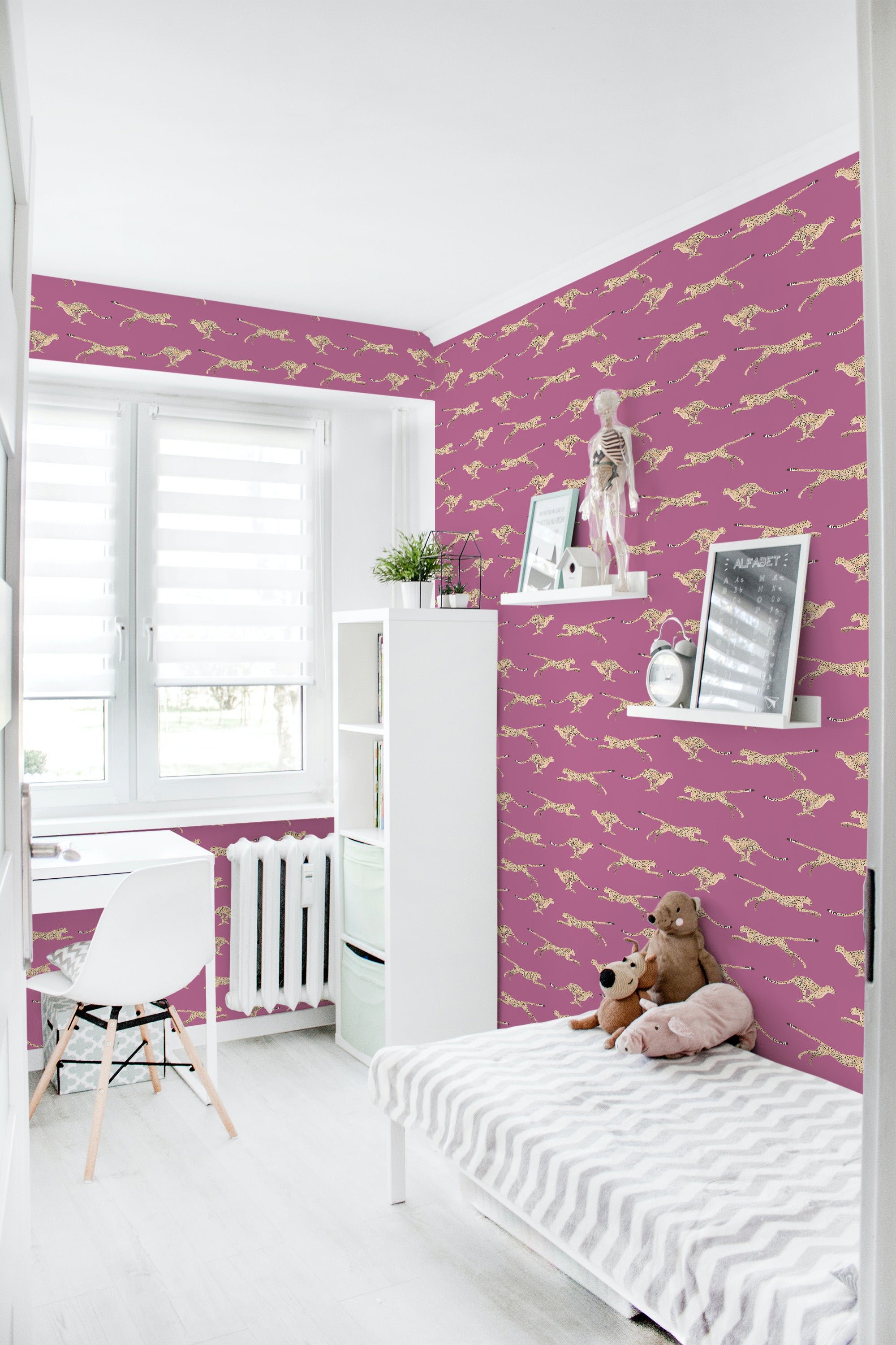 A room with walls adorned in a cheetah-themed wallpaper, showing yellow cheetahs on a pink background. The wallpaper adds a bold, dynamic look to the space, blending modern colors with traditional wallpaper.