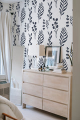         
peel and stick wallpaper tropical leaves accent wall bedroom dresser mirror minimalist interior