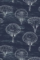 Illustration of skydivers descending with parachutes against a dark navy background, creating a dynamic and adventurous pattern. The hand-drawn white parachutes and skydivers are spaced evenly across the wallpaper, creating a sense of movement. Peel and stick removable wallpaper.