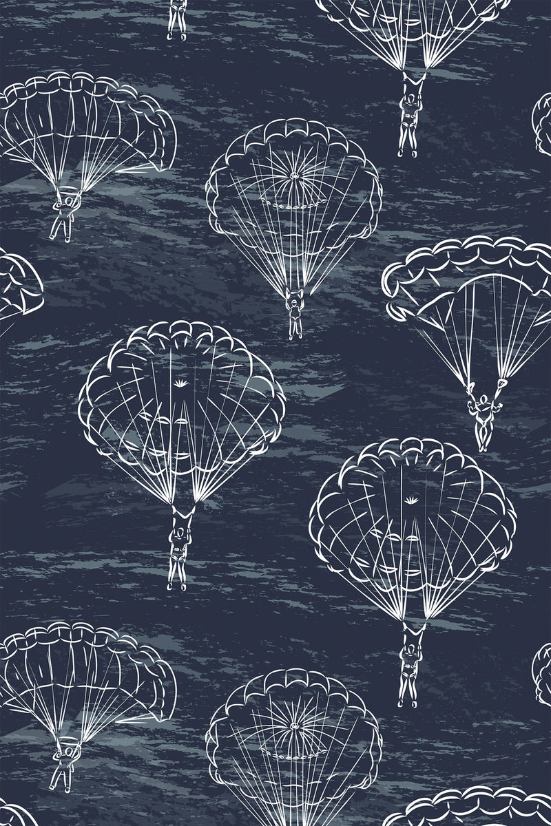 Illustration of skydivers descending with parachutes against a dark navy background, creating a dynamic and adventurous pattern. The hand-drawn white parachutes and skydivers are spaced evenly across the wallpaper, creating a sense of movement. Peel and stick removable wallpaper.