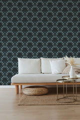 A room with a dark-colored wallpaper featuring an intricate, symmetrical geometric pattern inspired by traditional wallpaper.