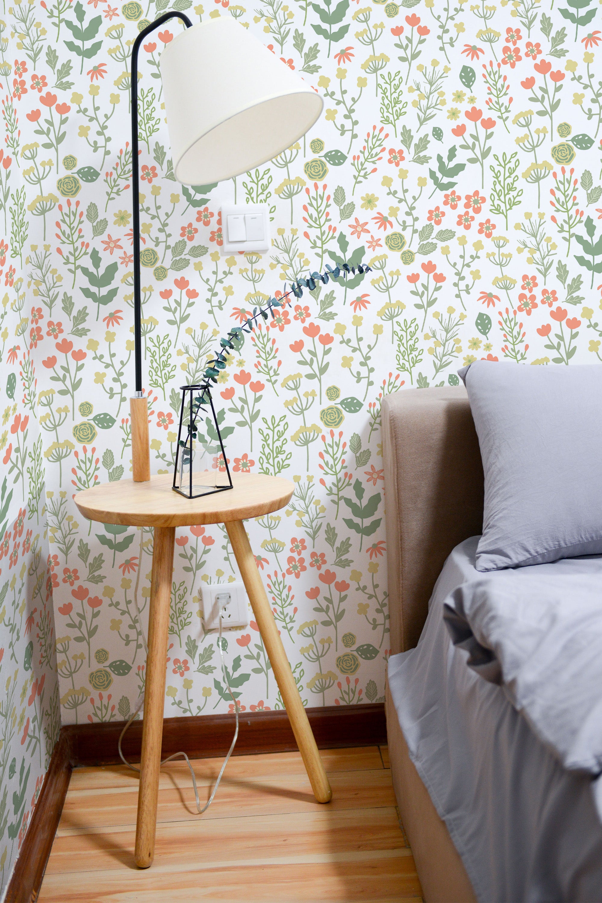 Self-adhesive wallpaper with a Soft fall design, showcasing delicate floral patterns in soft pastel colors like green, pink, and orange, creating a calming, nature-inspired atmosphere in the room.