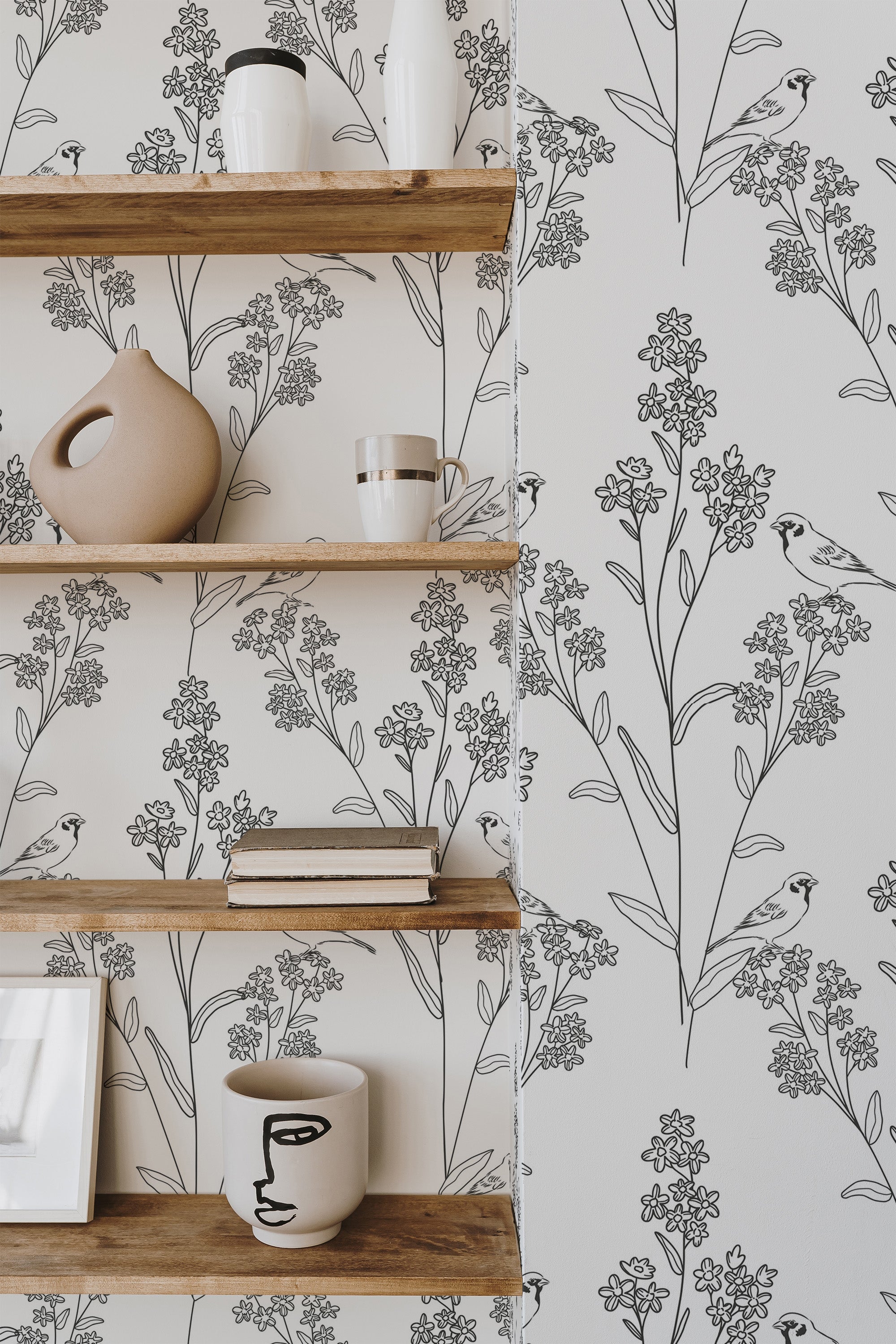 Self-adhesive wallpaper with a Bird Meadow design, featuring delicate birds perched among blooming flowers and tall stems in a minimalistic black-and-white line art style.