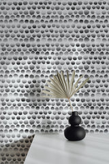 Self-adhesive wallpaper with an abstract Moon dots design, featuring a pattern of varying black and grey dots on a light background, creating a modern, minimalist feel in the room.