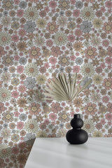 Self-adhesive wallpaper with a neutral retro floral design in shades of pink, yellow, brown, and grey on a white background, featuring various sizes and shapes of flowers.