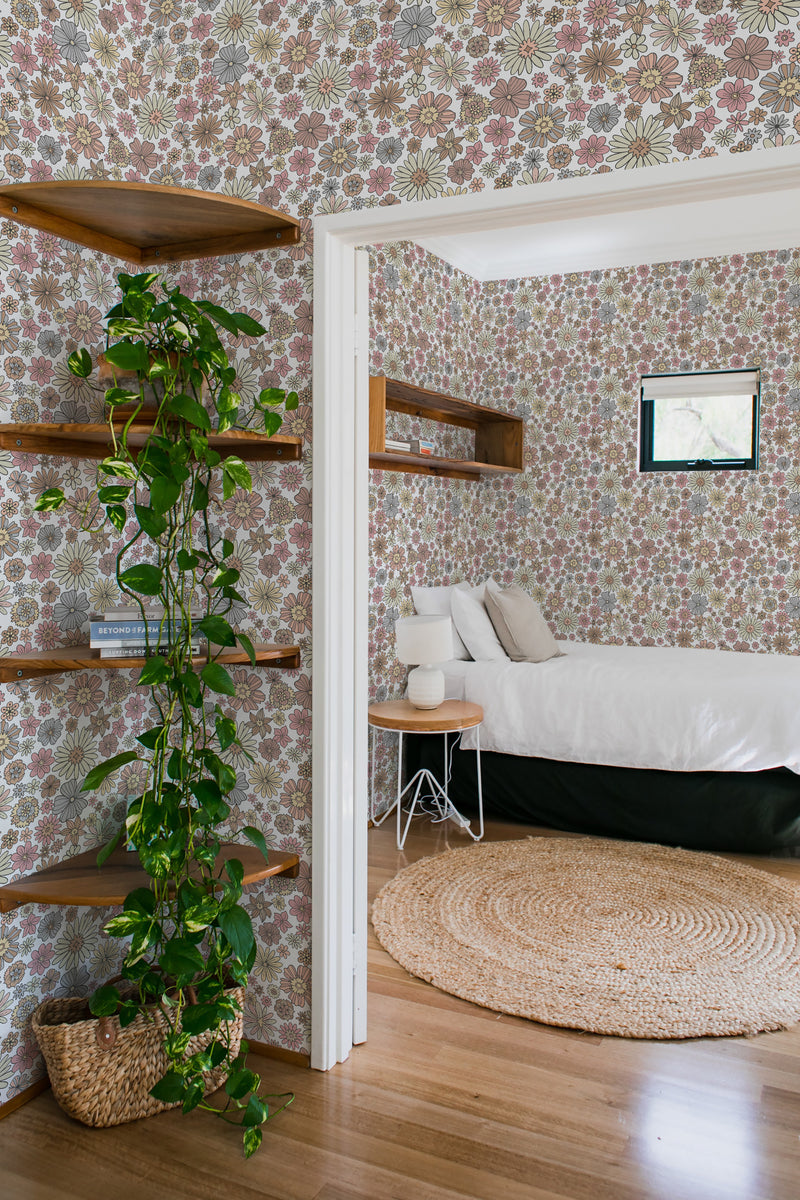 Room with neutral retro floral wallpaper, featuring intricate patterns of flowers in muted tones of brown, beige, and olive green. A cozy, traditional wallpaper.