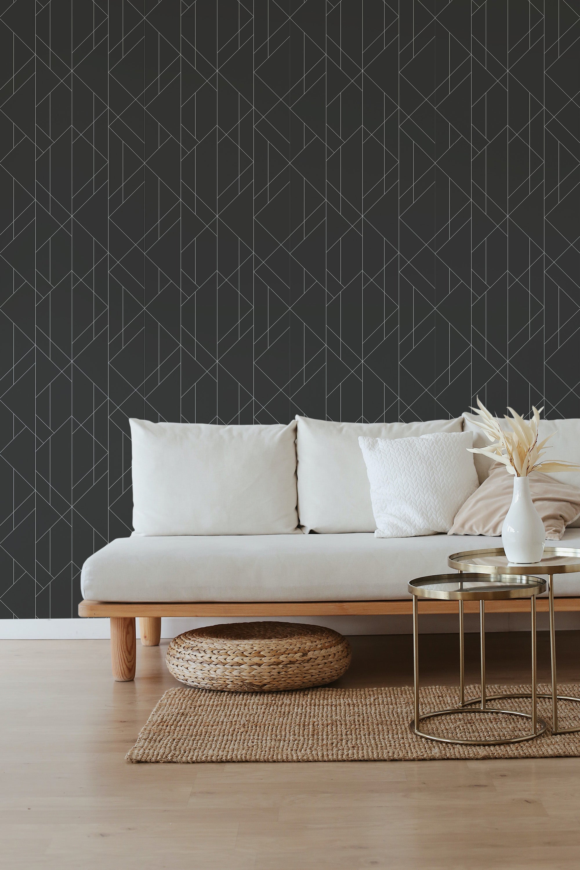 Black art deco wallpaper with a geometric pattern of intersecting lines forming angular shapes, creating a bold and sophisticated look. Traditional wallpaper.