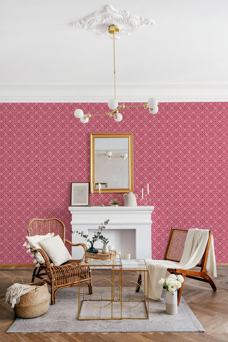 An ethnic-inspired wallpaper in viva magenta with intricate, symmetrical patterns, creating a rich and vibrant atmosphere. Traditional wallpaper.