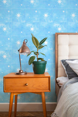 Self-adhesive wallpaper with a Serendipity star tile pattern on a light blue background, featuring white stars in various sizes evenly spaced out.