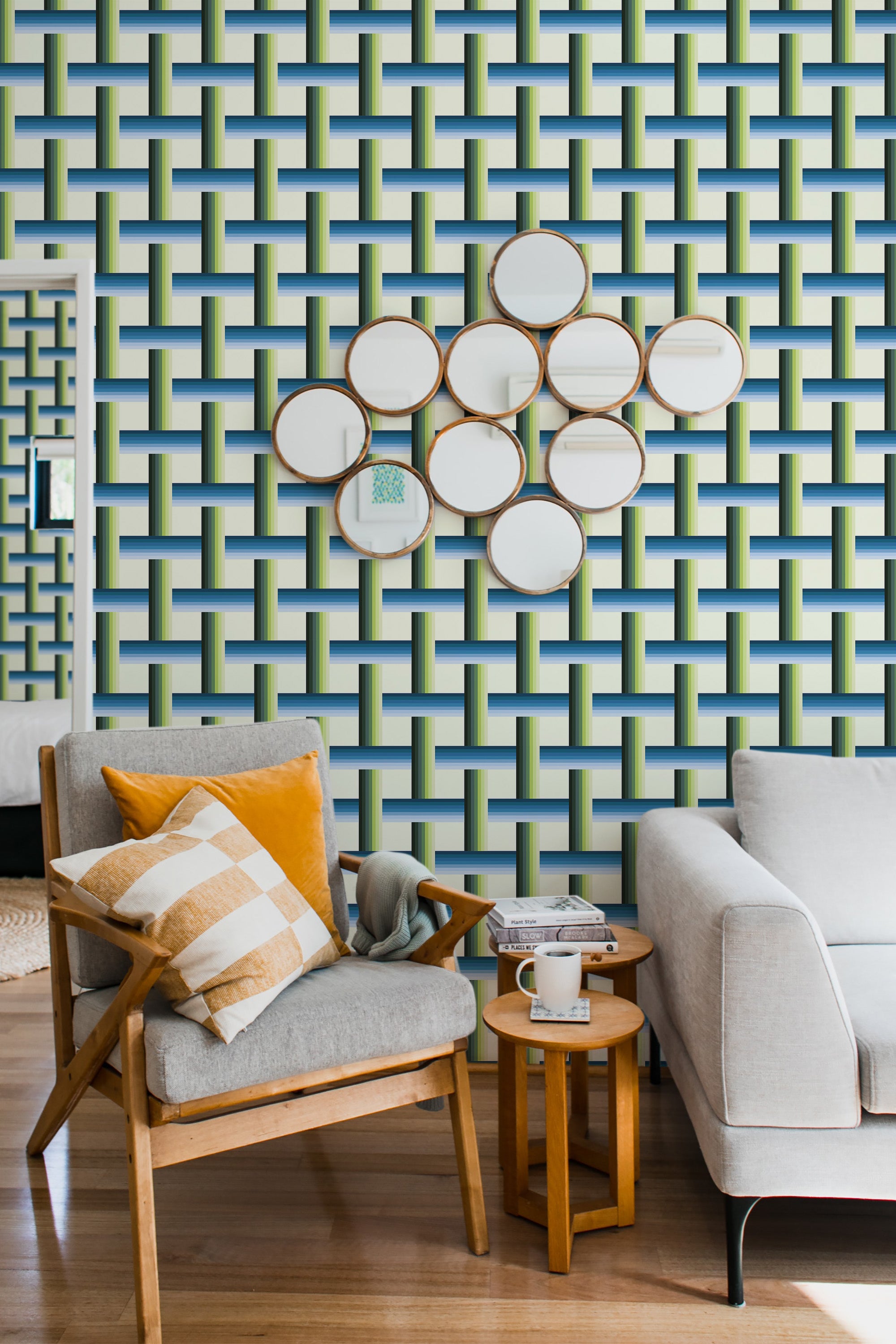 A room with a bold 15th-century stripe wallpaper design, featuring interlocking horizontal and vertical stripes in blue, green, and white tones, creating a geometric pattern. Soft furnishings in neutral hues complement the striking traditional wallpaper.