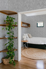 bedroom cozy interior green plants round carpet snowy forest peel & stick wallpaper
