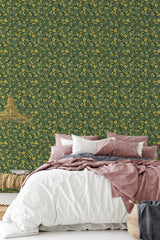simple cozy bedroom pillows blankets bold green bush wall decor