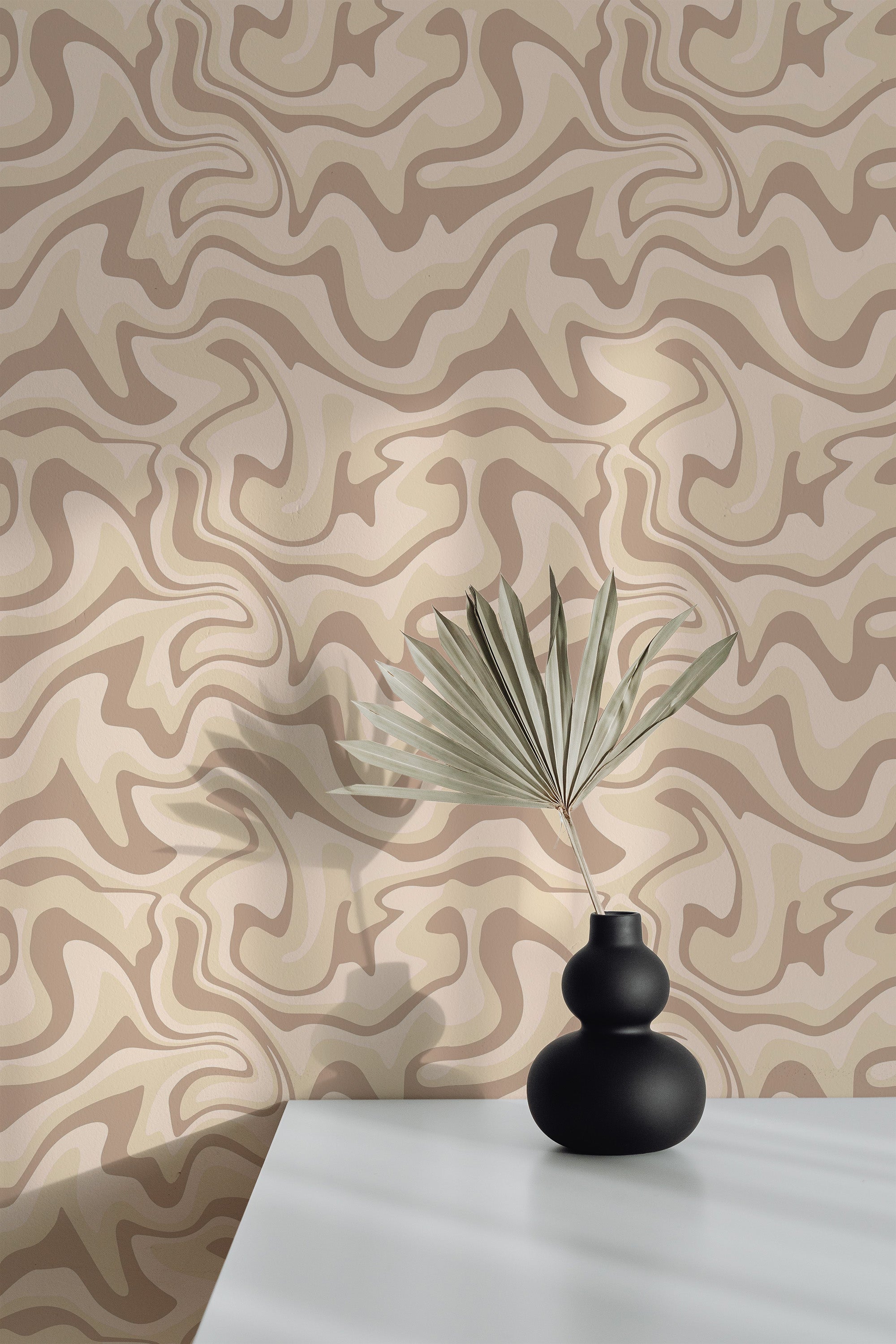 Self-adhesive wallpaper with a neutral abstract line pattern in soft beige, taupe, and cream tones. The wavy lines create a fluid, calming effect, ideal for adding a subtle artistic touch to a room.