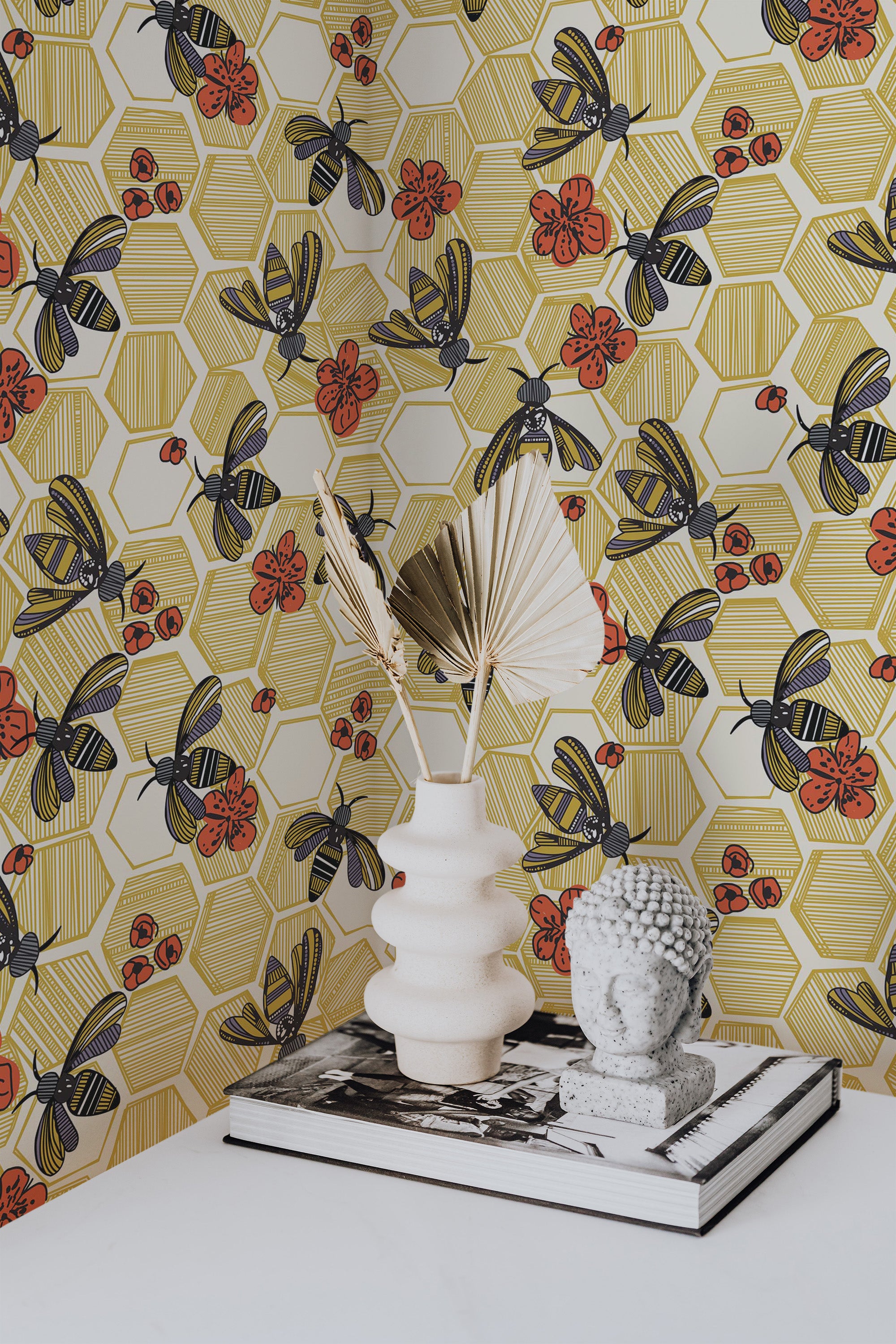 Self-adhesive wallpaper with a colorful honeycomb pattern, accented by bees and red flowers against a yellow and white geometric background.