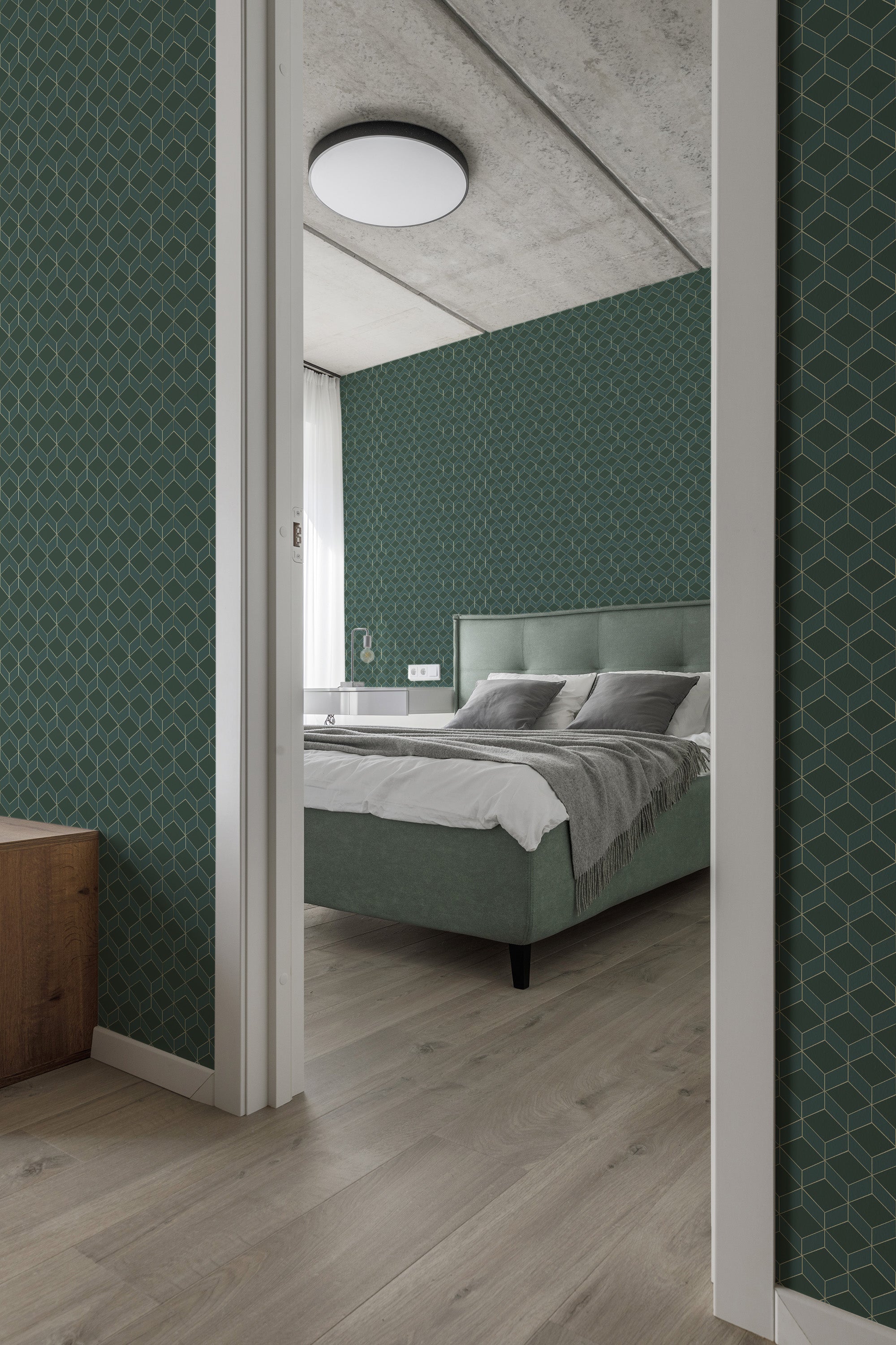 Emerald green art deco wallpaper with geometric lines forming intricate patterns creating a stylish, vintage atmosphere in a contemporary bedroom lit by natural light. Traditional wallpaper.
