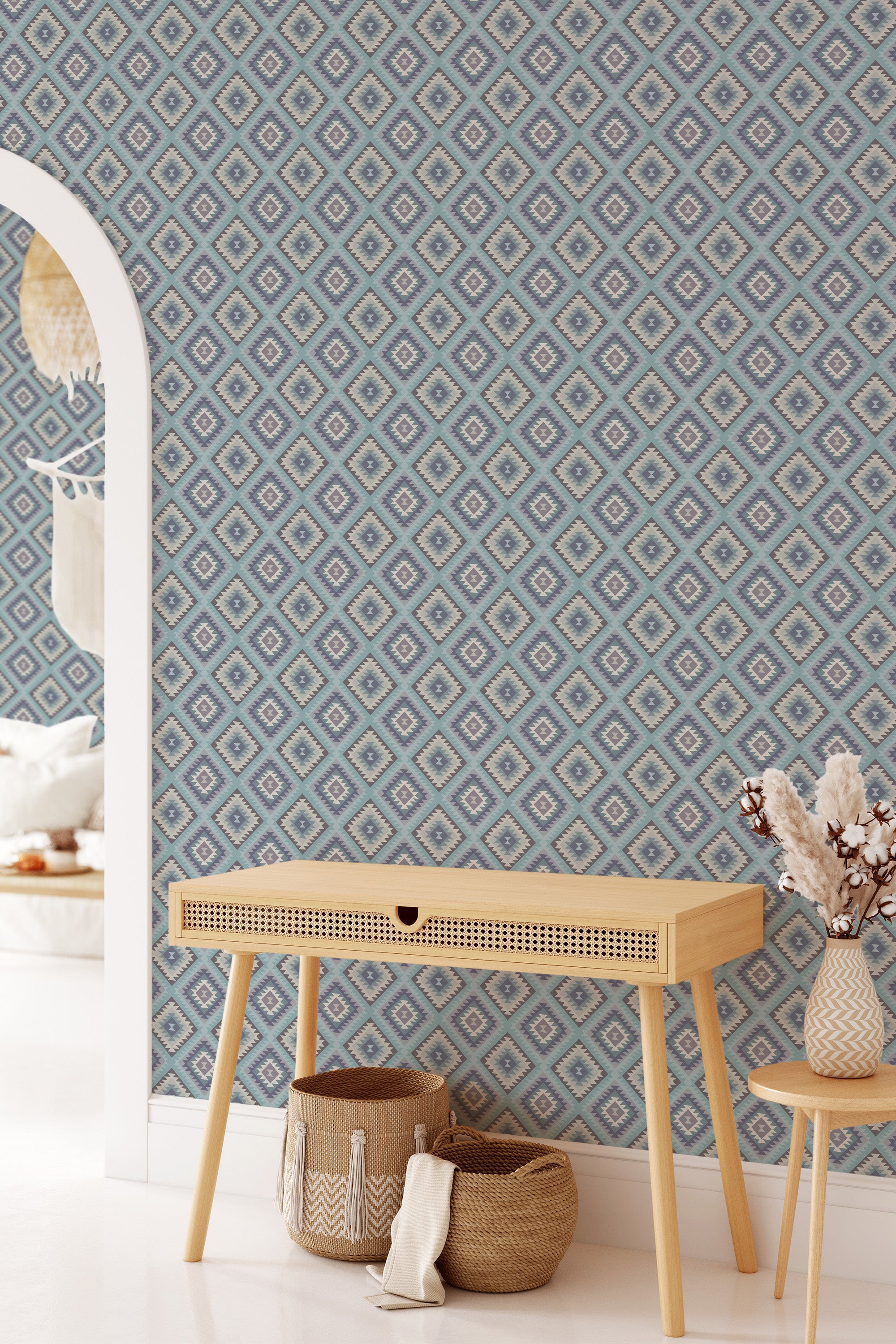 Blue aztec wallpaper with intricate geometric patterns in diamond shapes, combining shades of blue, grey, and white, adding a traditional touch to the room.