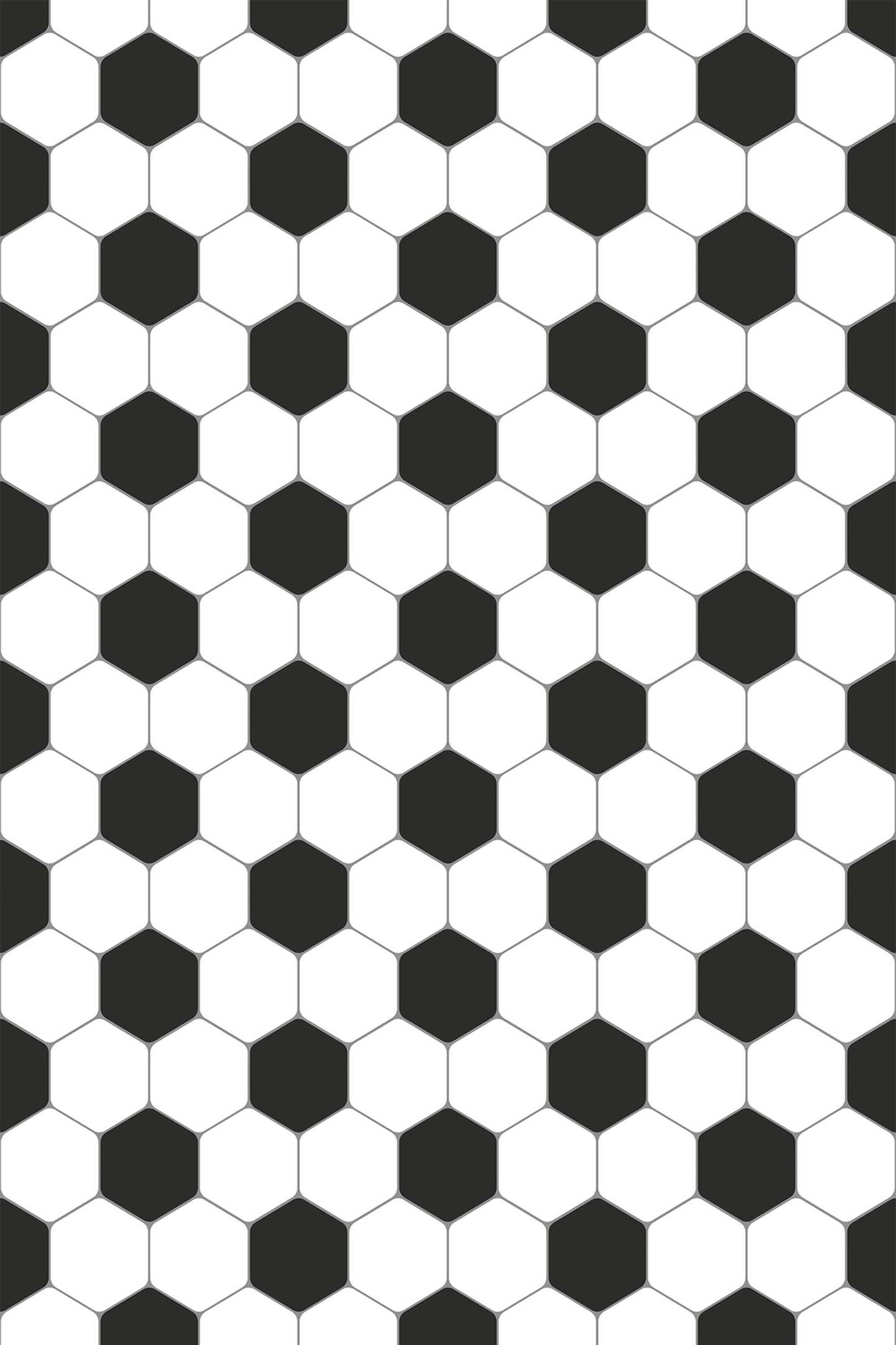 A repeat pattern of alternating black and white hexagons resembling a soccer ball pattern in a classic design. Peel and stick removable wallpaper.