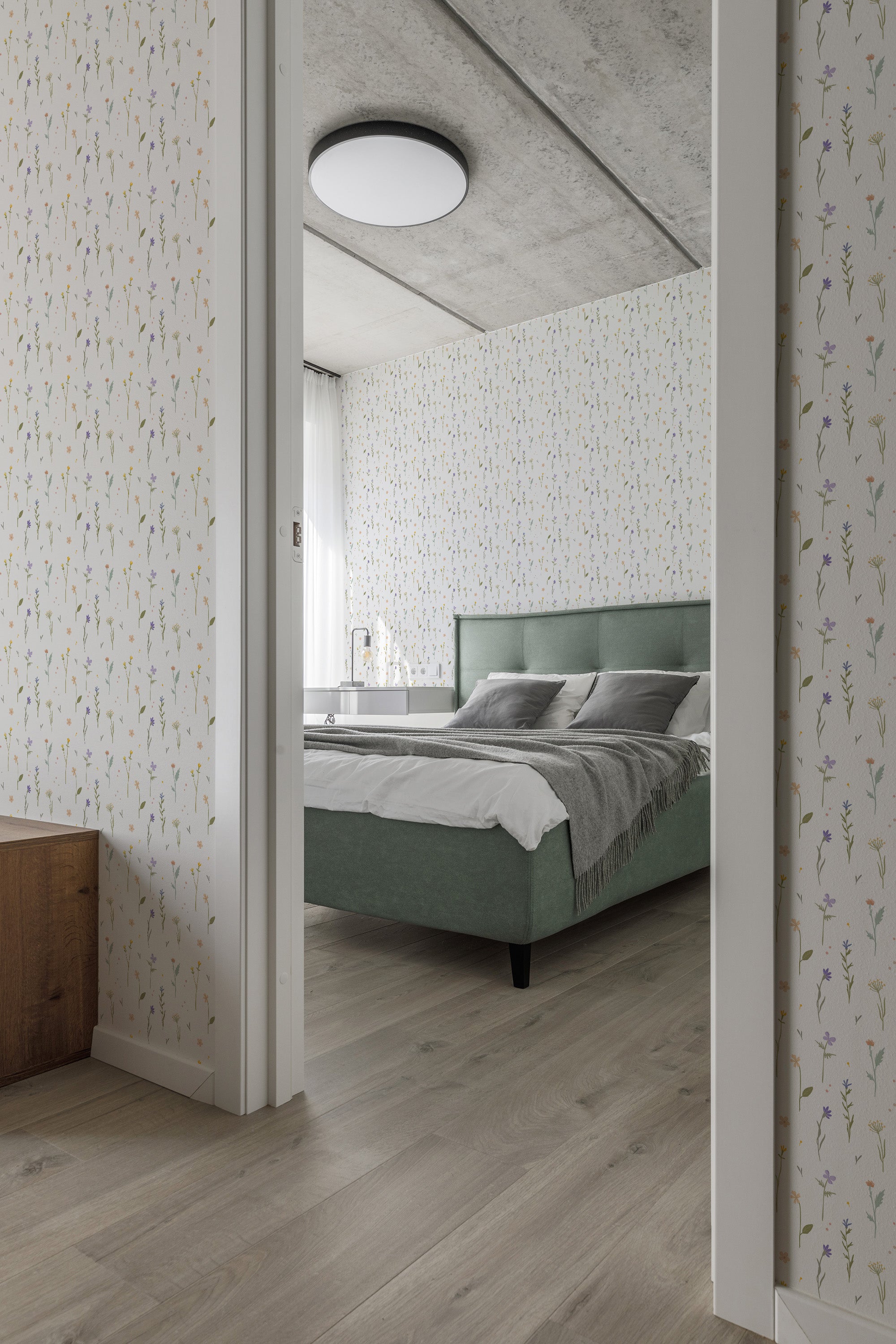 Wallpaper adorned with a delicate pattern of small, pastel-colored flowers on a light background in a bedroom. Traditional wallpaper.