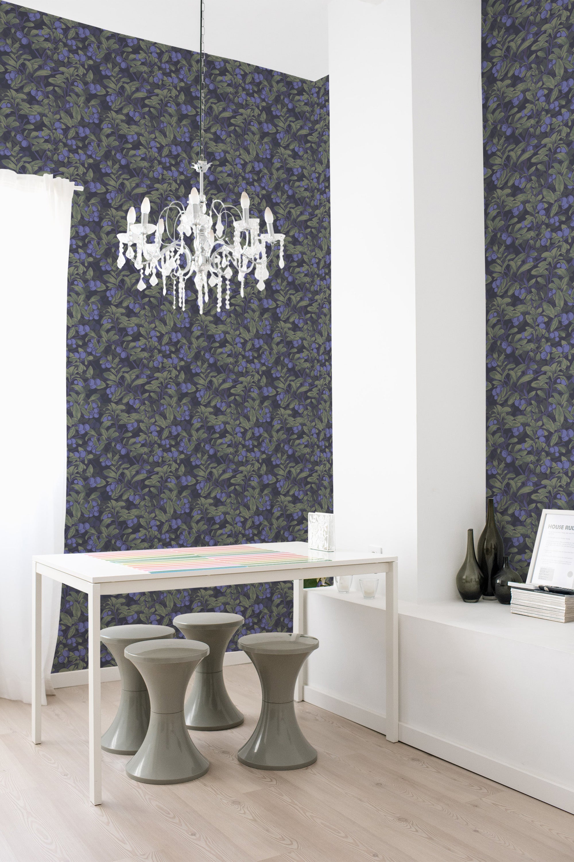 Wallpaper with dark green leaves and clusters of blueberries against a deep blue background, creating a lush, nature-inspired pattern in a traditional wallpaper.