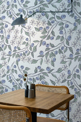 Self-adhesive wallpaper with a whimsical design of cartoon blueberries, leaves, and delicate flowers on a light background, creating a playful and nature-inspired atmosphere.