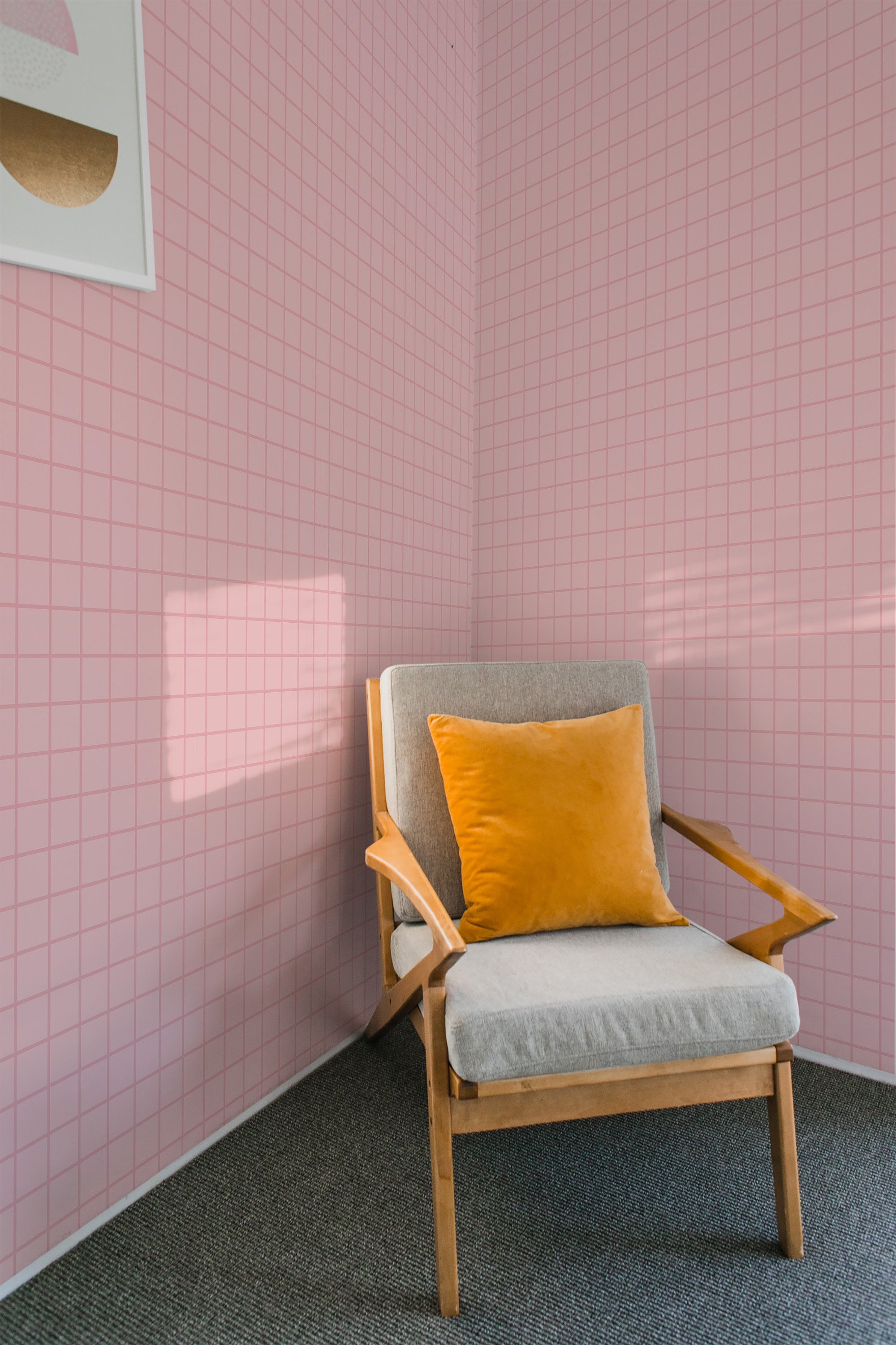 A cozy room with walls covered in baby pink plaid wallpaper with delicate square patterns and soft pastel tones. Traditional wallpaper.