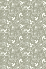 A vintage floral pattern with delicate white flowers and leaves on a muted green background, elegantly intertwined with subtle swirling vines. Peel and stick removable wallpaper.