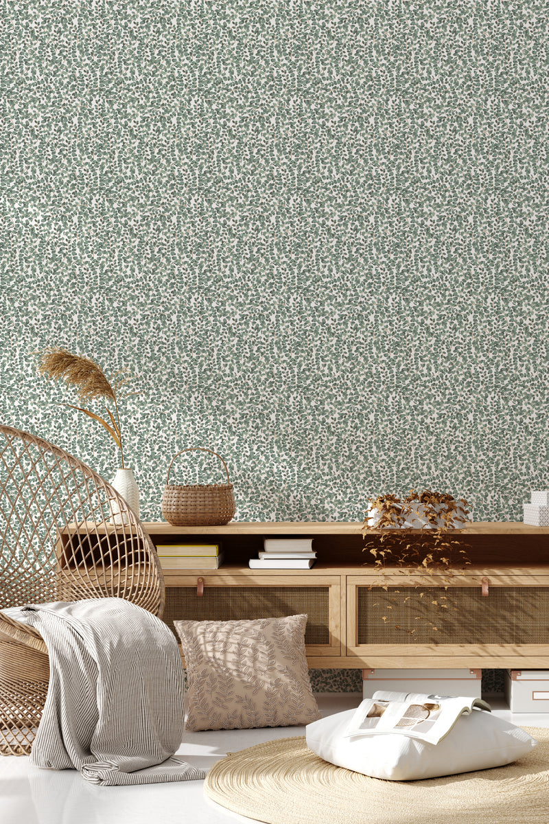 The wallpaper has a design with subtle green leaves arranged in a neat, dense pattern, creating a natural, Scandinavian-inspired look. Traditional wallpaper.