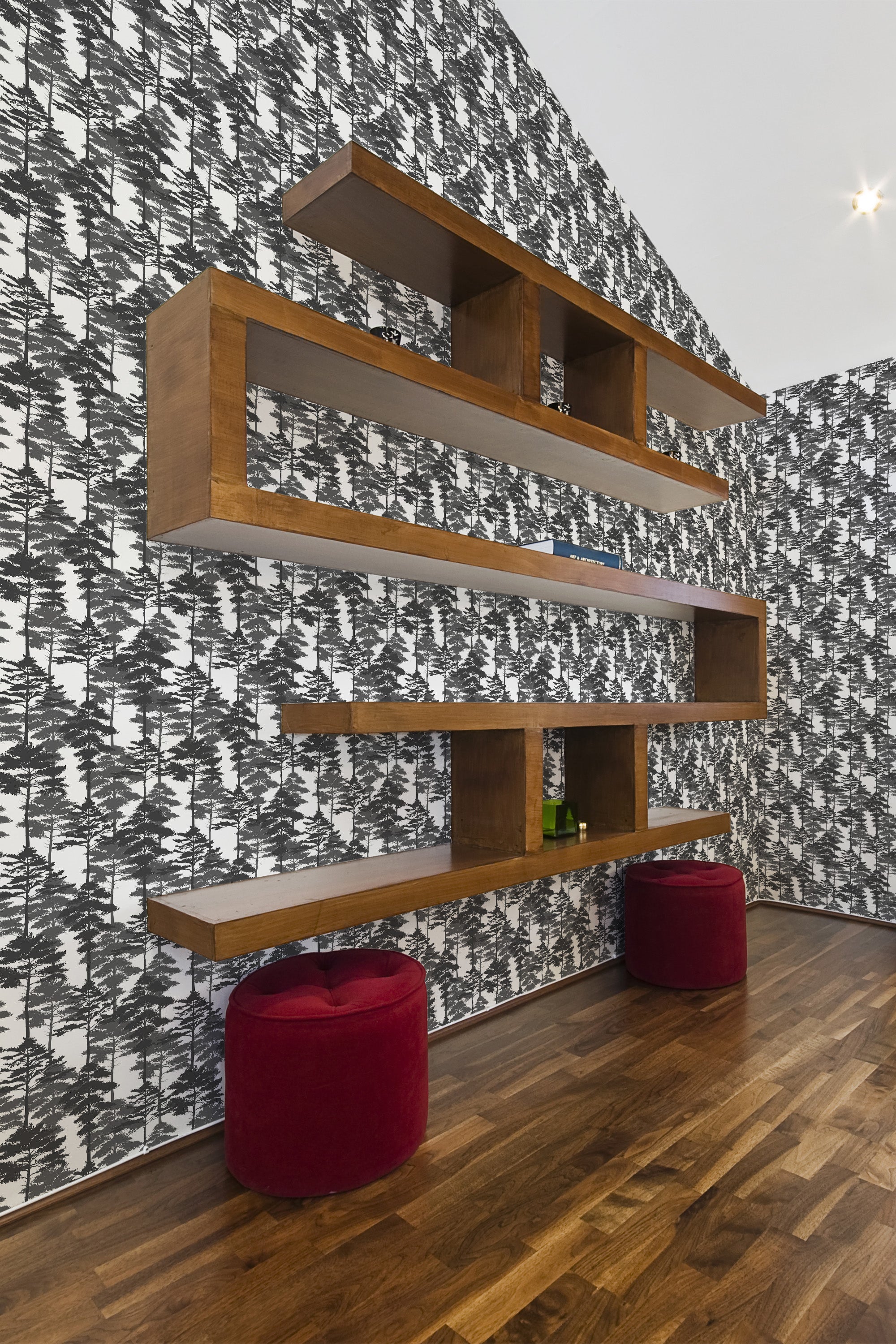Black and white abstract tree pattern wallpaper adorns the walls, creating a natural and monochromatic theme, contrasting with dark wood flooring and shelving. Traditional wallpaper.