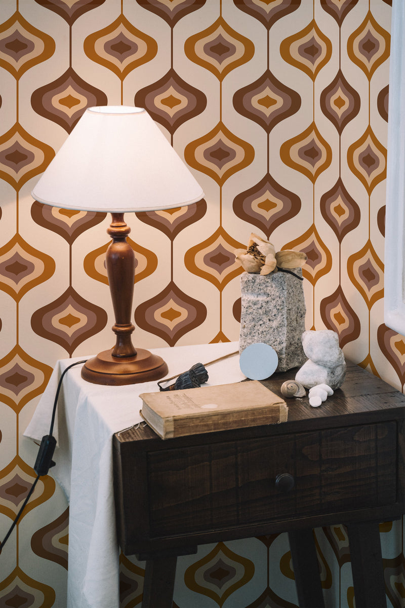 Self-adhesive wallpaper with a retro 70s design featuring geometric patterns in brown, orange, and cream tones, adding a warm and vintage aesthetic to the room.