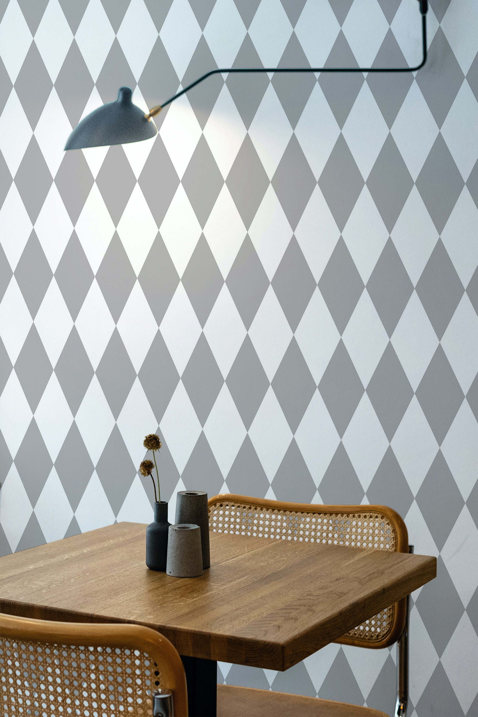Self-adhesive wallpaper with a Gray argyle design, arranged in a series of diamond shapes featuring alternating light and dark shades.