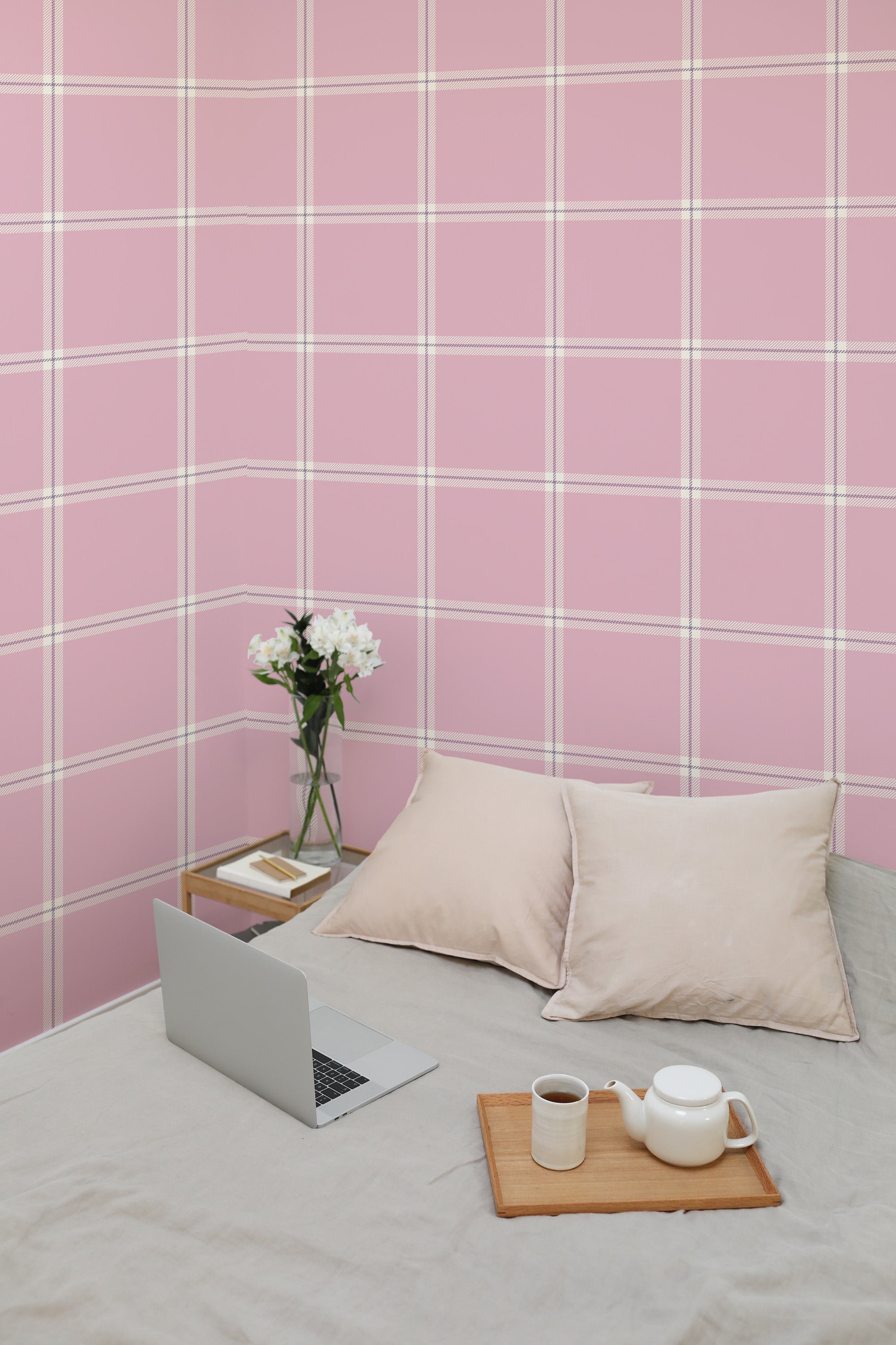 Self-adhesive pink plaid wallpaper with white crisscrossing lines creates a cozy ambiance in the room.