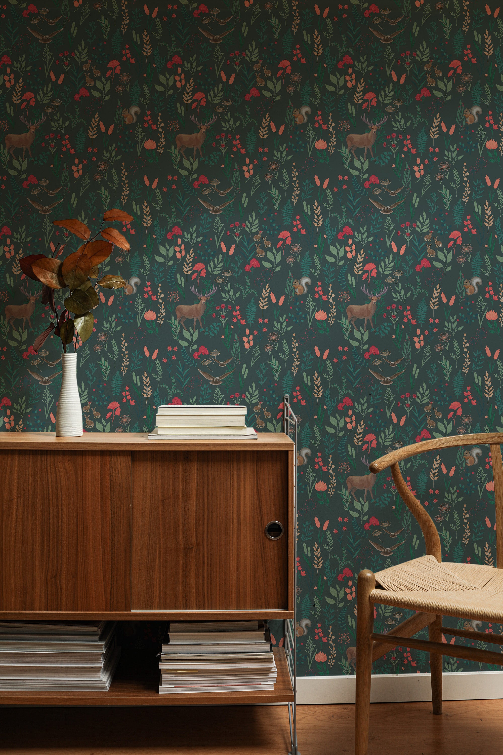 Self-adhesive wallpaper with a dark green forest theme, adorned with intricate illustrations of woodland animals, foliage, and bright-colored flowers, adding a natural and whimsical touch to the room.