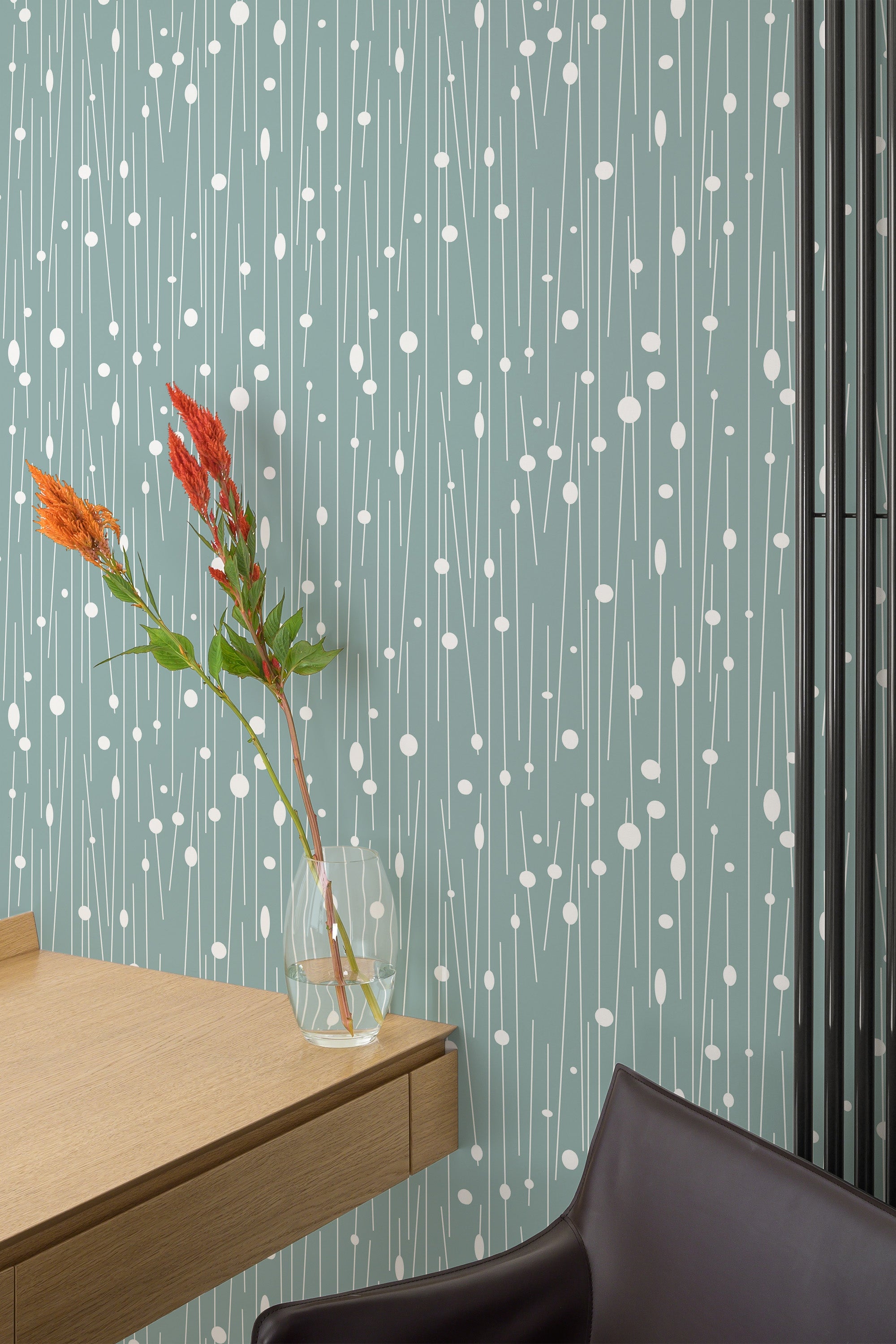 Self-adhesive wallpaper with a teal background adorned with delicate, vertical white lines and small circular dot patterns, creating a modern and minimalist look.