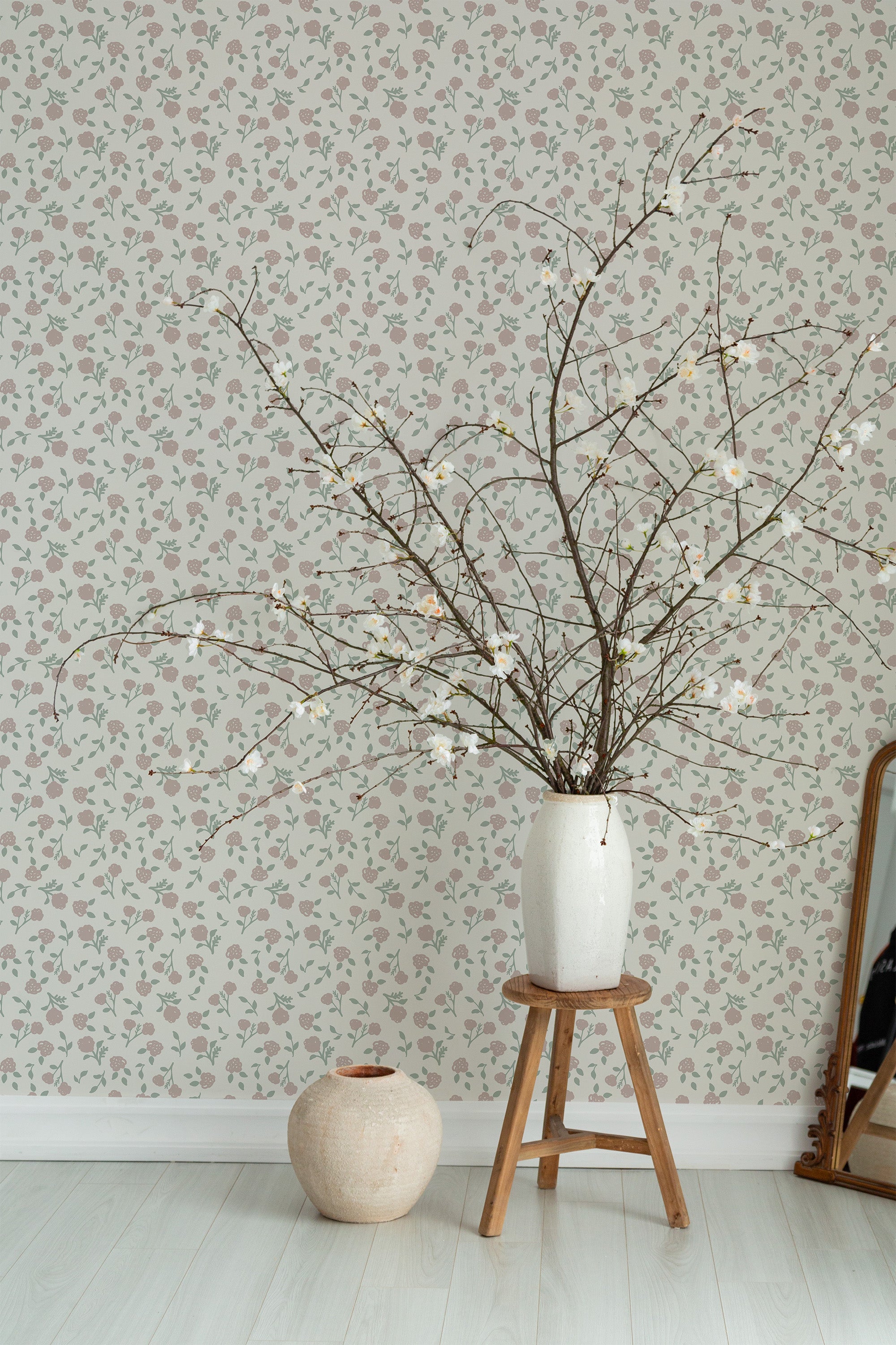 Self-adhesive wallpaper with a delicate Scandinavian rose pattern, where small, soft pink roses and green leaves create a subtle, elegant floral design on a neutral background.