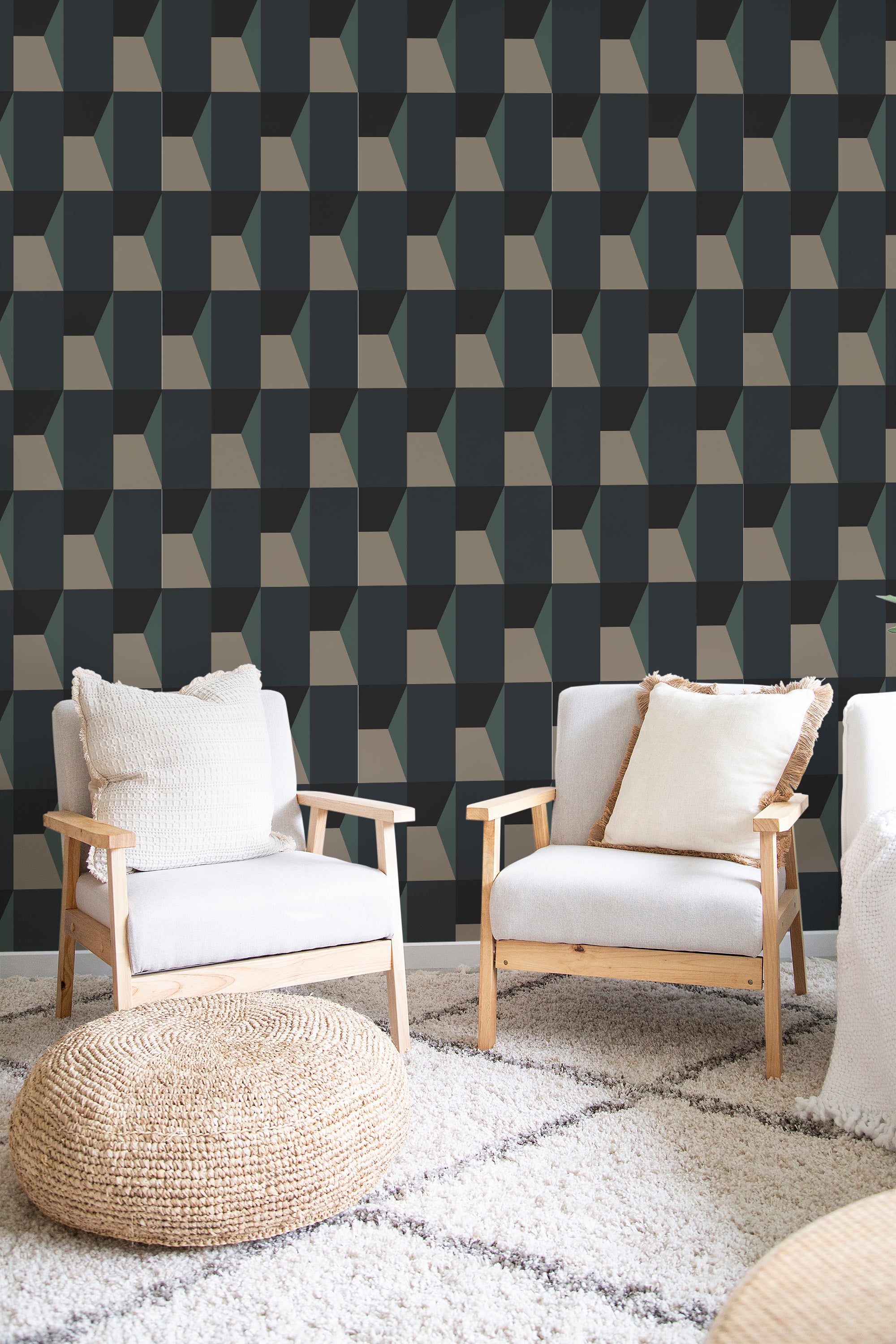 A room with Blue Bold geometric wallpaper in a repeating pattern of dark blue, grey, and white cubes creating a three-dimensional effect on the wall, paired with light-colored furniture and a neutral-toned rug. Traditional wallpaper.
