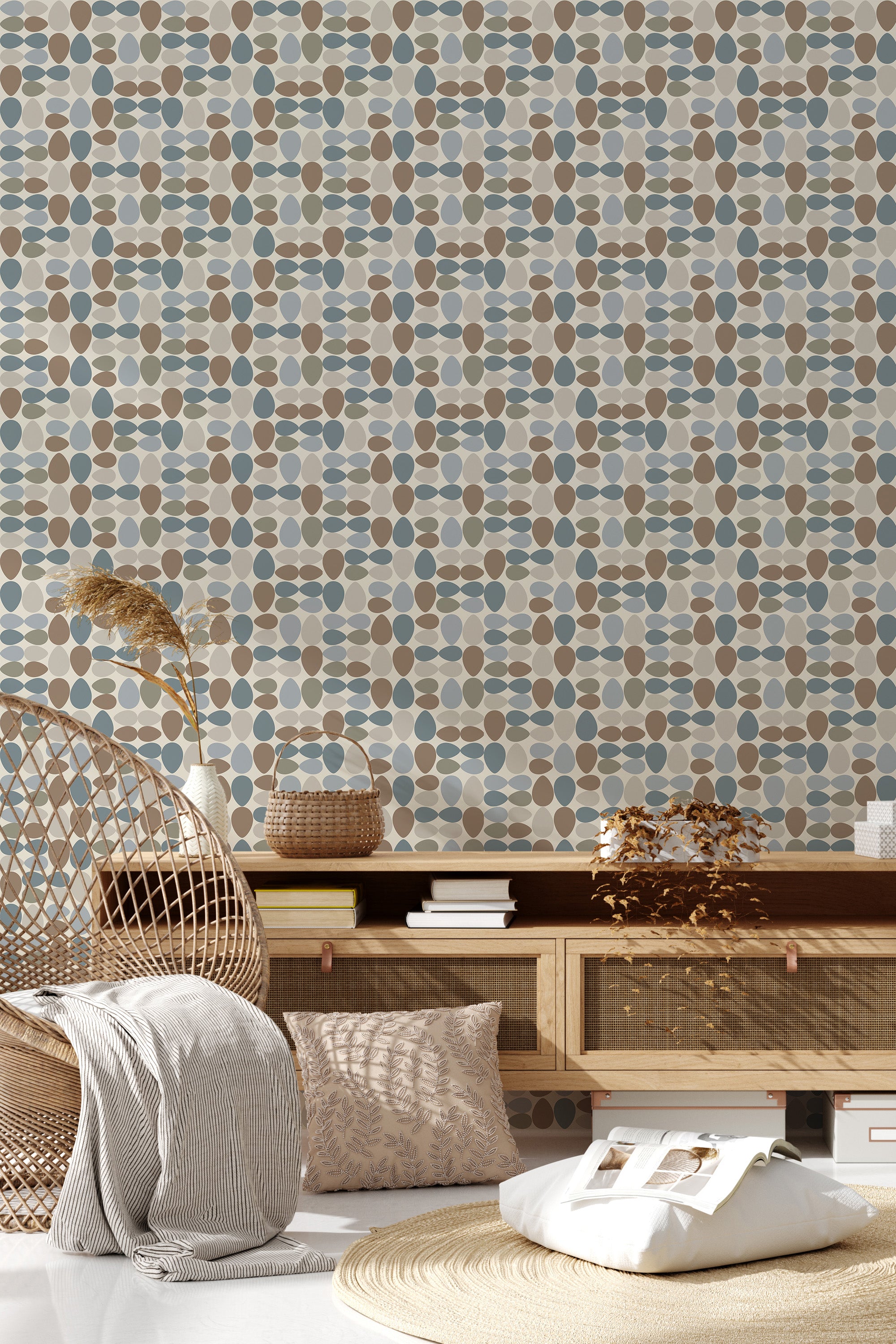The wallpaper design has a repeating pattern of oval and rectangular shapes in muted tones of blue, brown, tan, and beige, creating a retro aesthetic reminiscent of mid-century modern style. Traditional wallpaper.