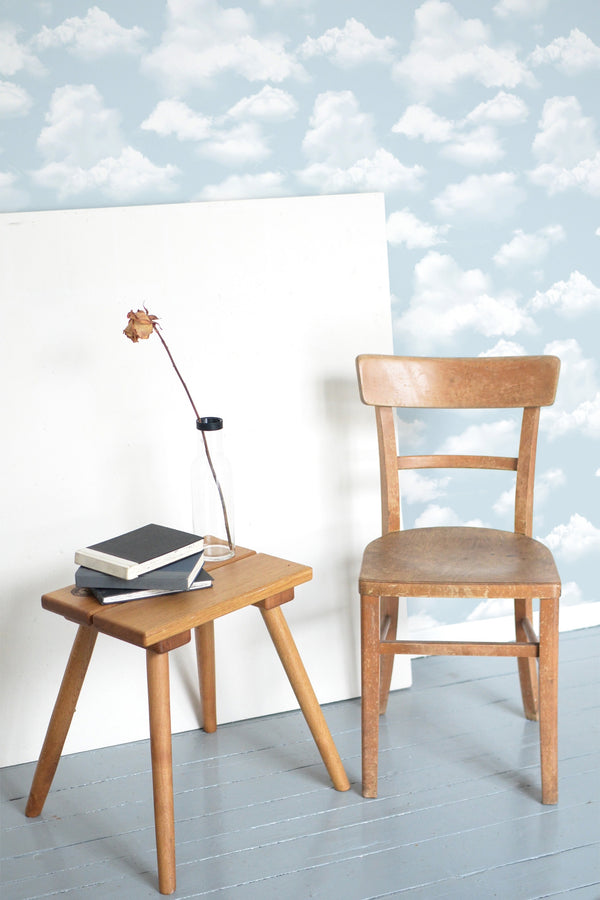 wooden table chair decorative plant blank canvas beachy clouds self adhesive wallpaper