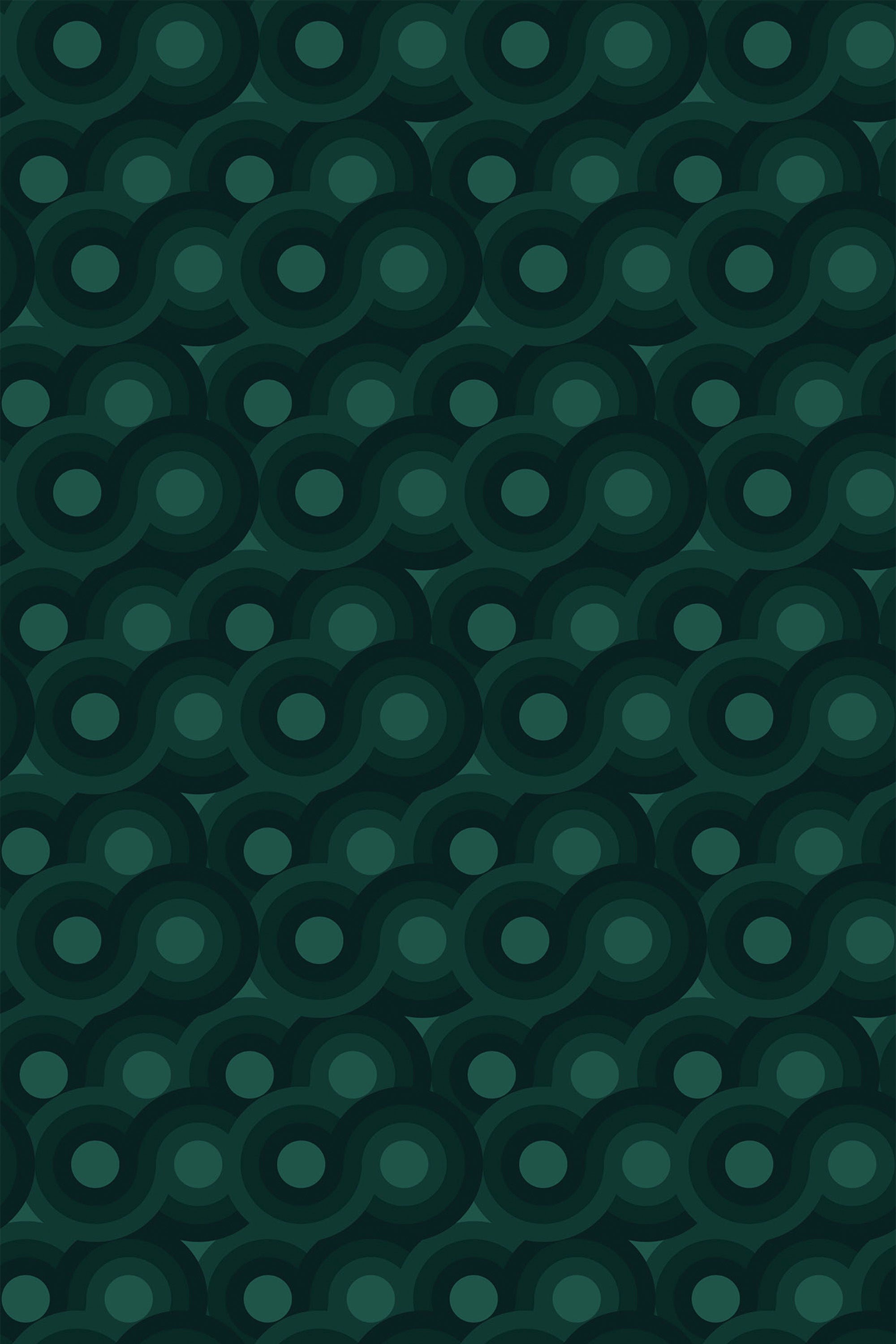 Forest green retro wallpaper with a seamless pattern of interlocking circles and ovals in varying shades of dark green. Peel and stick removable wallpaper.