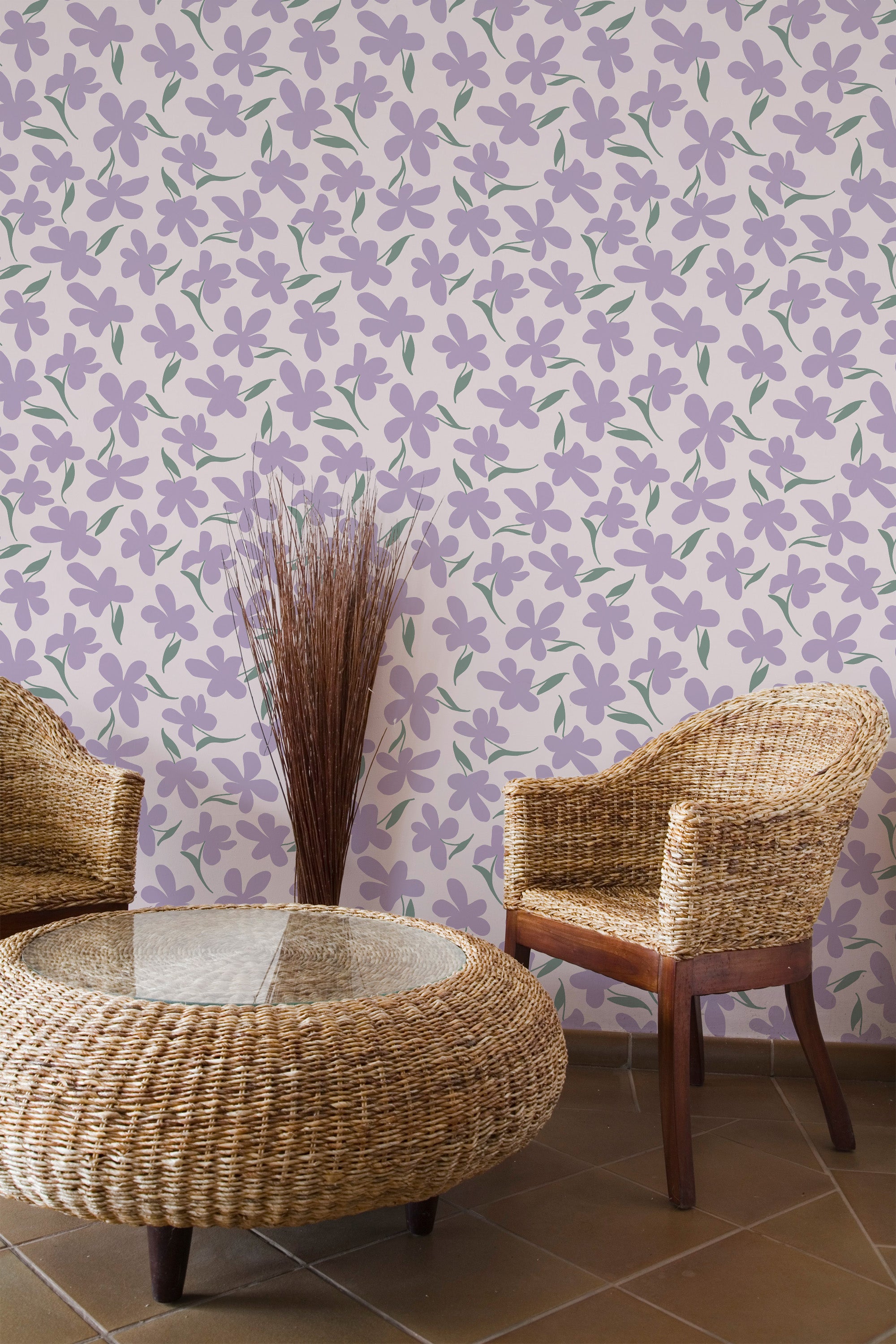 Self-adhesive wallpaper with a pattern of scattered purple flowers and green stems, creating a lively and natural ambiance in the room, paired with rattan furniture.