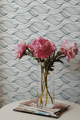 Self-adhesive wallpaper with flowing ocean wave patterns in a soothing gray tone, creating a serene backdrop.