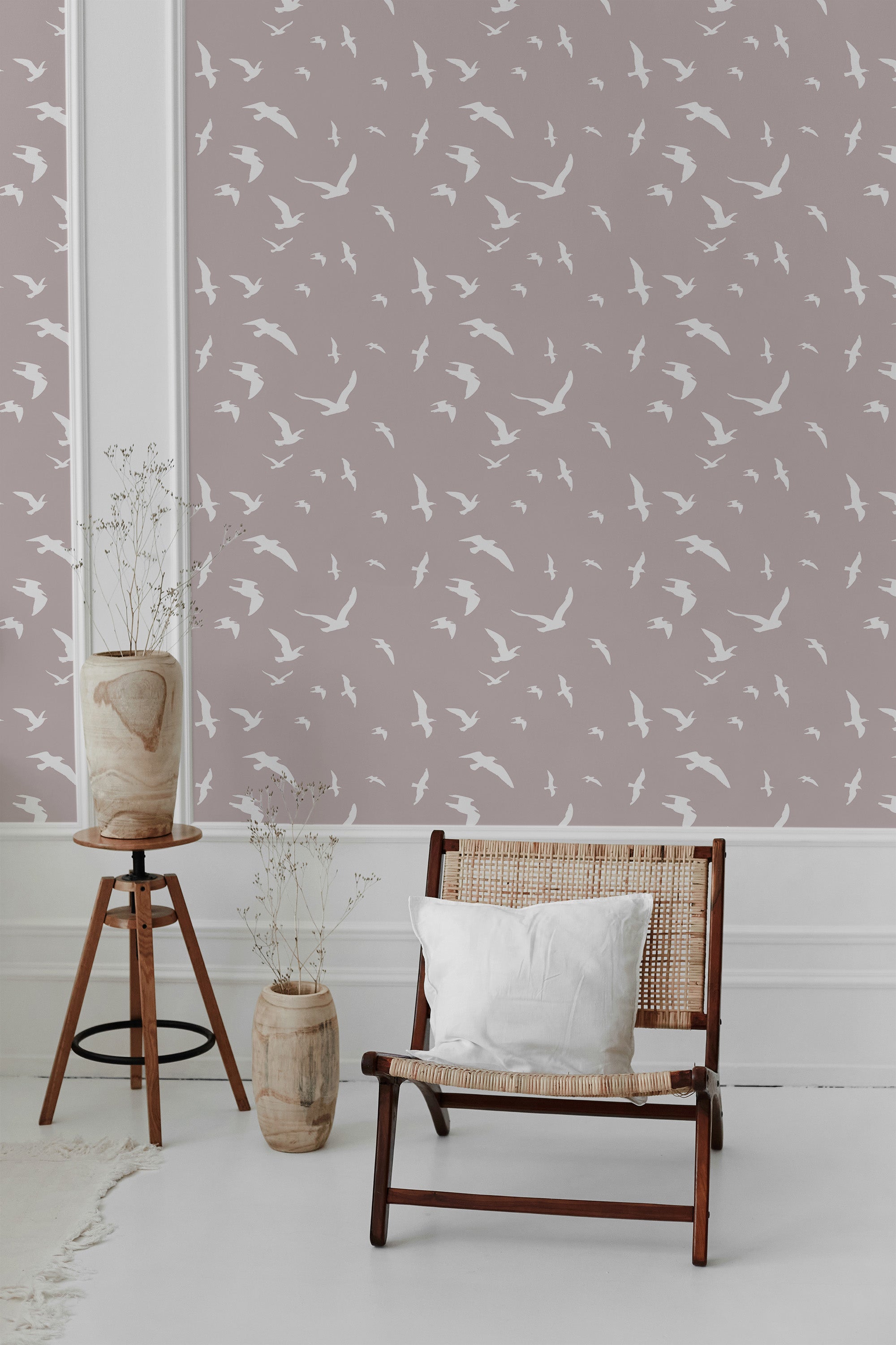 Wallpaper adorned with a soft backdrop, displaying white small birds in flight pattern, adding a serene and airy touch to the space. Traditional wallpaper.