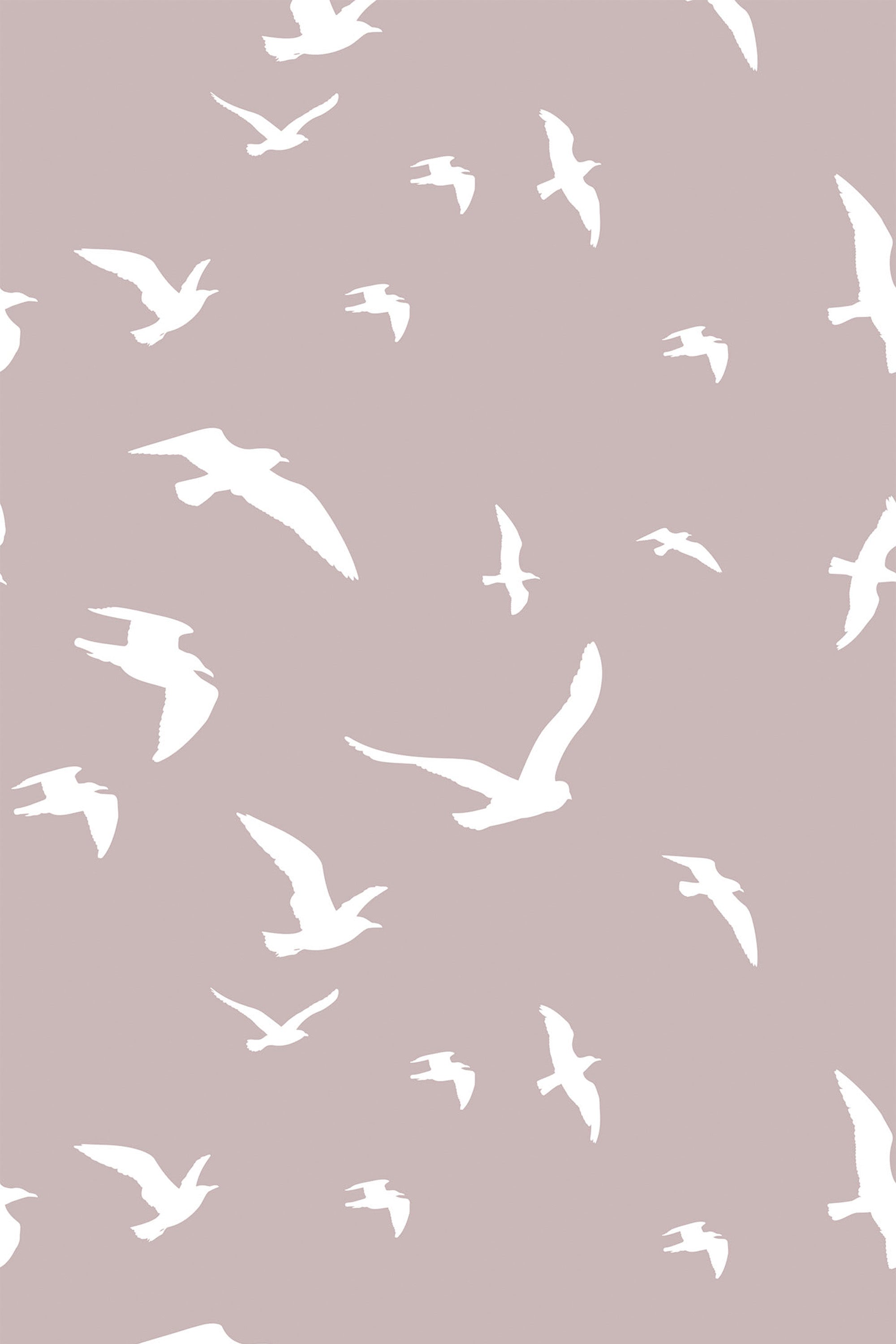 Pattern with white, minimalistic birds soaring in various directions on a muted taupe background, peel and stick removable wallpaper.