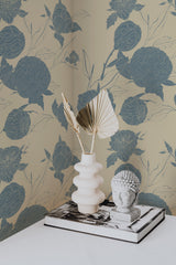 Self-adhesive wallpaper with a Peony garden design in muted tones of navy blue and beige, showing intricate floral patterns of large, blooming peonies intertwined with delicate leaves.