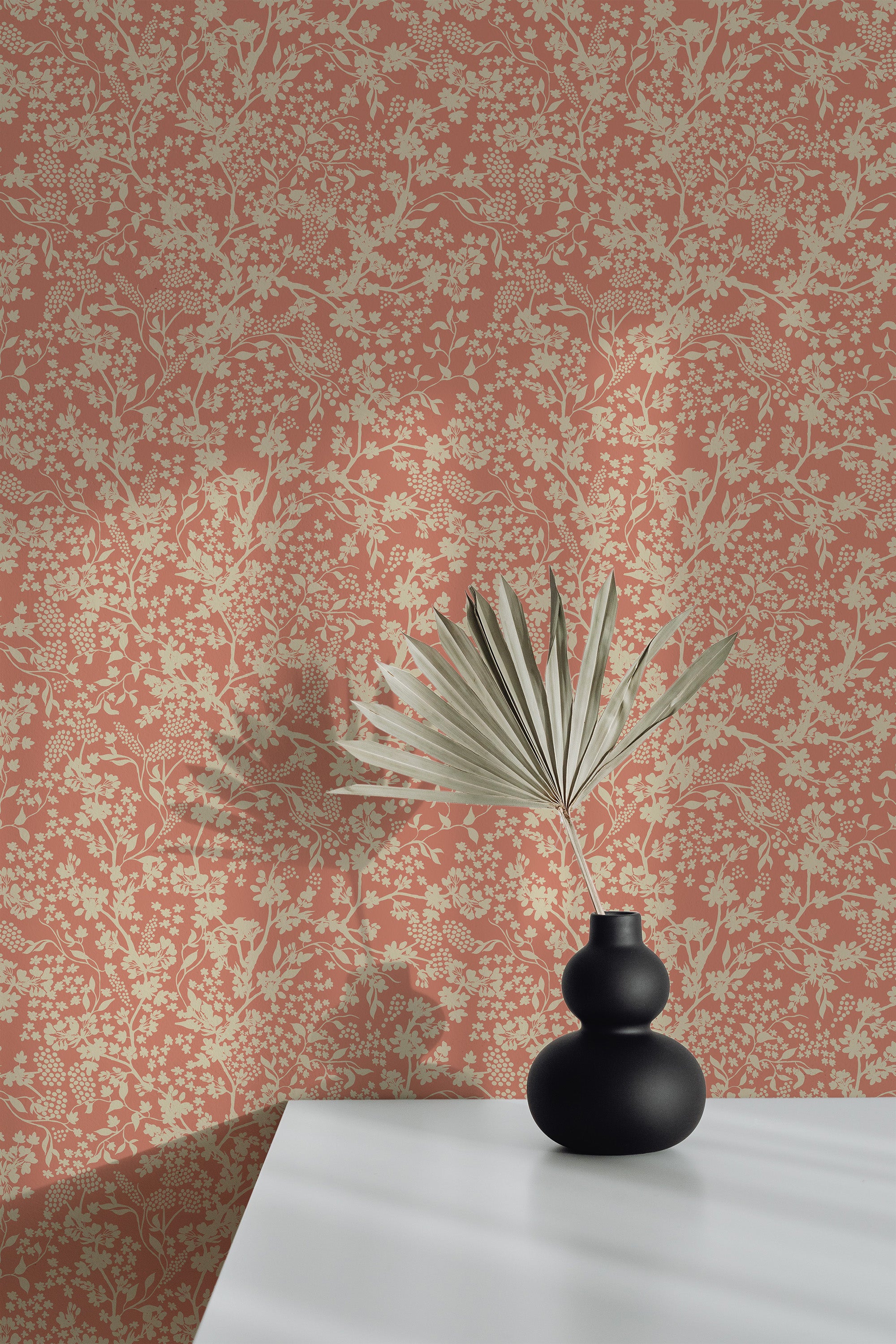 Self-adhesive Vintage botanical wallpaper in a warm terracotta hue with an intricate pattern of light greenish-beige floral and foliage elements.